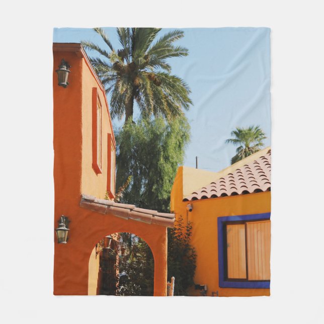 Green palm tree beside brown concrete building in  fleece blanket (Front)