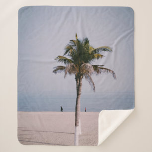 Green palm tree on seashore sherpa blanket