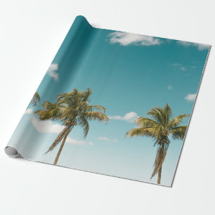 Green palm tree under blue sky in the morning wrapping paper
