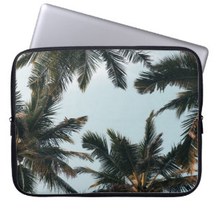 Green palm tree under white sky in the morning laptop sleeve