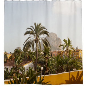 Green palm trees near brown concrete building in t shower curtain