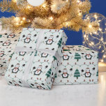 Green Penguins and Christmas Trees Christmas Wrapping Paper<br><div class="desc">Introducing our Modern Christmas Wrapping Paper, a festive tapestry of holiday cheer and whimsical charm. This wrapping paper features a lively green background adorned with an endearing pattern of super cute penguins, snowmen heads, Christmas lights, and Christmas trees. The delightful imagery creates a playful and heartwarming scene, capturing the essence...</div>
