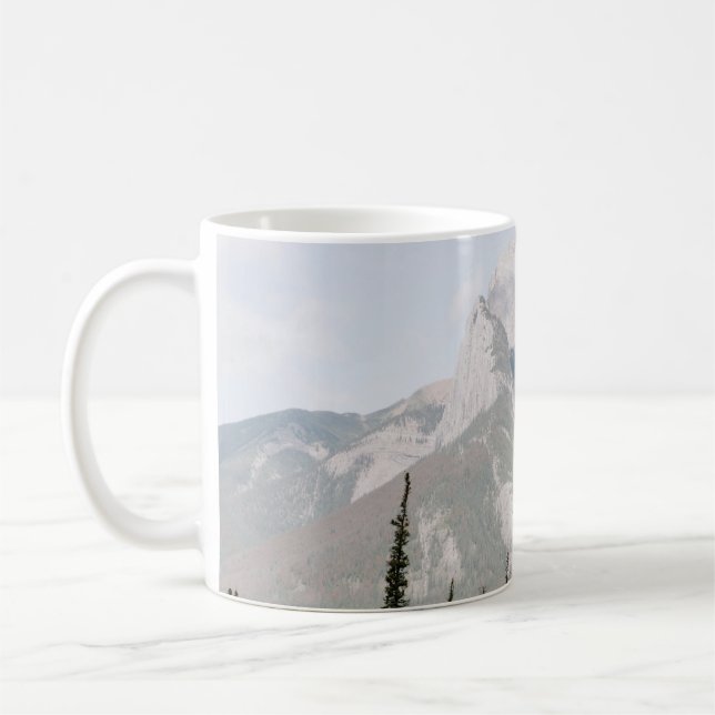 GREEN PINE TREES NEAR MOUNTAIN UNDER WHITE CLOUDS COFFEE MUG (Left)