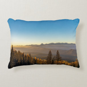 GREEN PINE TREES ON MOUNTAIN UNDER BLUE SKY DURING DECORATIVE CUSHION