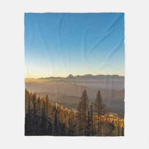 GREEN PINE TREES ON MOUNTAIN UNDER BLUE SKY DURING FLEECE BLANKET