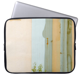 GREEN PLANT WITH CERAMIC VASE BESIDE WHITE WOODEN LAPTOP SLEEVE