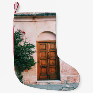 GREEN PLANTS BESIDE BROWN WOODEN DOOR SMALL CHRISTMAS STOCKING