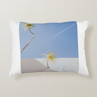 Green plants near white wall decorative cushion