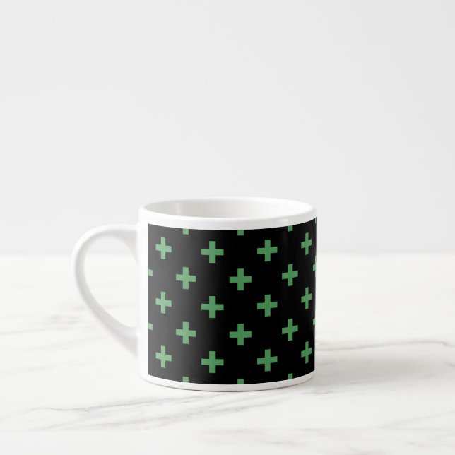 Green polka crosses on black espresso cup (Left)