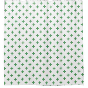 Green polka crosses on white shower curtain