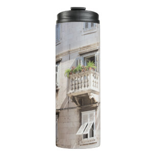 GREEN POTTED PLANT ON BROWN CONCRETE HOUSE BALCONY THERMAL TUMBLER