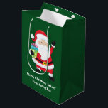 Green Santa Claus Customised Kids Christmas Medium Gift Bag<br><div class="desc">Personalised green Santa Claus gift bag for your kids Christmas gifts. Customise your children's holiday presents to and from with their custom name under smiling Papa Noel in his jolly red suit.</div>