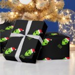Green Santa Claus martian Christmas wrapping paper<br><div class="desc">Green Santa Claus martian Christmas wrapping paper. Green alien head wearing a Santa hat gift wrap personalised with custom text. Funny black gift wrap design for Holiday presents.  Extraterrestrial life space cartoon illustration for kids and adults.  Custom colour background.</div>