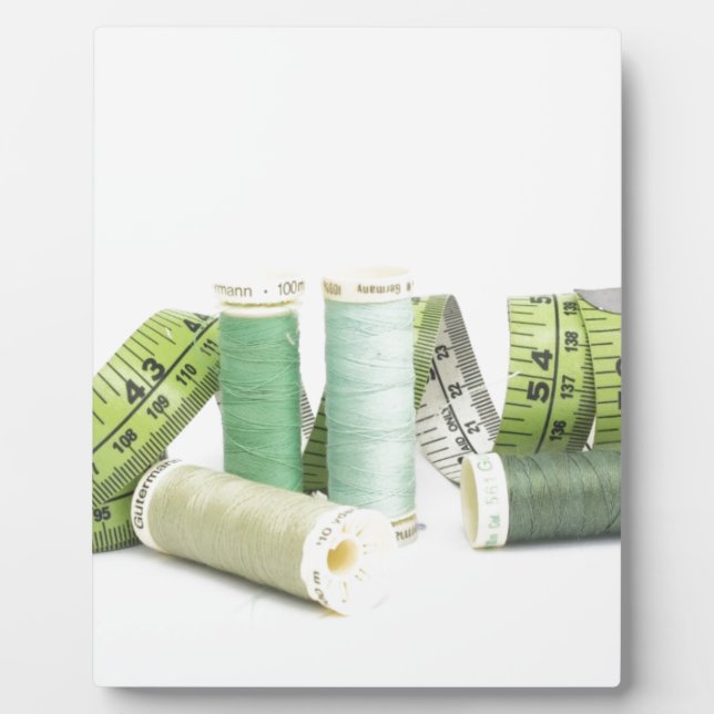 Green sewing kit and threads plaque (Front)