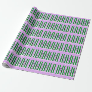 Green skis with snow on purple wrapping paper