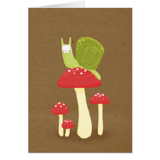 Green snail on red speckled mushrooms