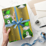 Green Snowman on Gold Christmas Wrapping Paper<br><div class="desc">A very festive golden Christmas wrapping paper featuring a whimsical pattern of snowmen clad in green velvet,  wearing top hat and vest with golden stars and green ribbons all set on a beautiful golden background,  to add a cute,  colourful and joyful touch to your gifts this year.</div>