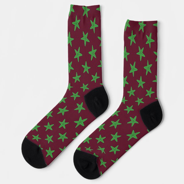 Green starfish on burgundy pattern socks (Left)