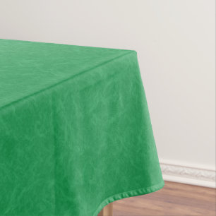 Green textured surface with swirling pattern tablecloth