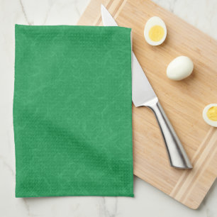 Green textured surface with  swirling pattern tea towel