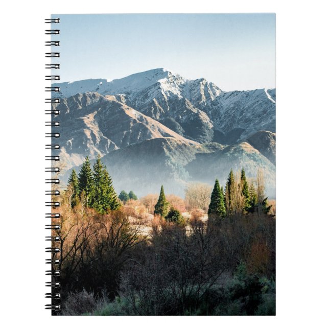 GREEN TREES NEAR SNOW COVERED MOUNTAIN DURING DAYT NOTEBOOK (Front)