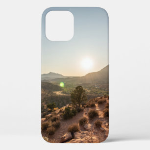 GREEN TREES ON BROWN MOUNTAIN DURING DAYTIME iPhone 12 CASE