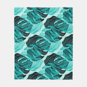 Green tropical palm leaves design. fleece blanket