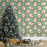 Green Vintage Santa Claus Christmas<br><div class="desc">Bring the magic of the holidays into your home with this green vintage Santa Claus Christmas wallpaper. Featuring charming illustrations of Santa's cheerful face and delicate snowflakes against a green background, this design adds a festive and nostalgic touch to any room. Perfect for creating a cosy and merry atmosphere, this...</div>