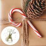 Green Watercolor Cosy Vintage Christmas Scene Classic Round Sticker<br><div class="desc">Bring the cosy charm of the holiday season to your gifts and packages with these watercolor Christmas stickers! Featuring a quaint vintage winter village scene with a charming Christmas tree, these stickers add a touch of rustic elegance. Perfect for adding a personalised touch to presents, cards, or even home decor,...</div>
