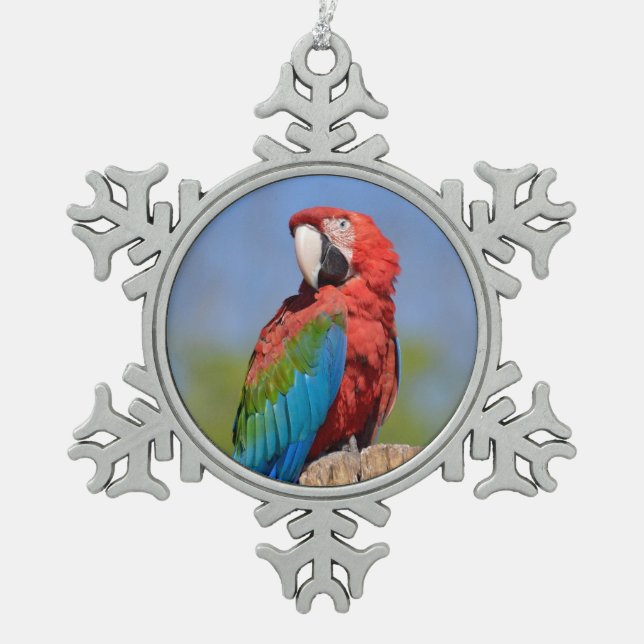 Green-winged macaw perched snowflake pewter christmas ornament (Front)