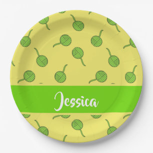 Green wool rolls on yellow paper plate