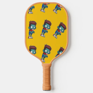 Green zombie kid on orange pickleball paddle