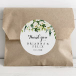 Greenery White Floral Thank You Wedding Favour Classic Round Sticker<br><div class="desc">This greenery white floral thank you wedding favour classic round sticker is perfect for a rustic wedding. The design features elegant watercolor white peonies with green foliage. Make the sticker labels your own by including your names, the event (if applicable), and the date. These stickers can compliment a wedding reception,...</div>