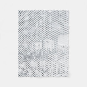 Grey and white chequered textile fleece blanket