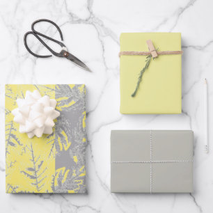 Grey and yellow leaves on a striped background. wrapping paper sheet