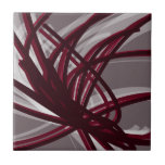 Grey & Burgundy Abstract Ribbons Tile<br><div class="desc">Modern artistic design featuring burgundy wine coloured ribbons with white accents on a grey background. Designed with vector graphics, you can create your own customised throw pillow by changing the background and border colours. To create your personalised design, select “customise” and navigate to the layers section to view the images...</div>
