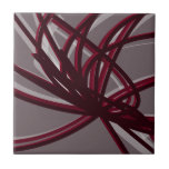 Grey & Burgundy Artistic Abstract Ribbon Tile<br><div class="desc">Grey and burgundy ceramic tile features an artistic abstract ribbon composition with shades of burgundy wine and grey with white accents on a grey background.</div>