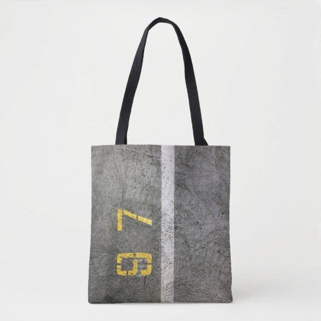 Grey concrete floor with 197 print tote bag (Front)