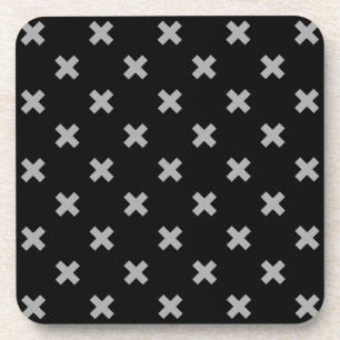 Grey cross stitches on black coaster