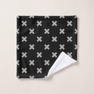 Grey cross stitches on black wash cloth