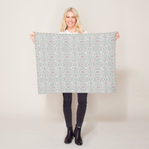 Grey, green, pink rhombuses on a white fleece blanket