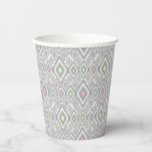 Grey, green, pink rhombuses on a white paper cups