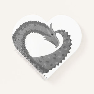 Grey heart dragon on white notebook