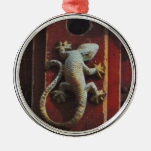 grey lizard on worn wood metal tree decoration