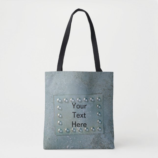 Grey metal with text plate on tote (Front)