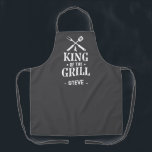 Grey Personalized King of The Grill Apron<br><div class="desc">A fun grilling apron with a bold “King of the Grill” graphic and crossed BBQ tools. Add any name under the design to make it personal. The dark background hides spills and the print has that classic backyard-BBQ vibe. Easy gift for dads, uncles, grandpas, and anyone who lives by the...</div>