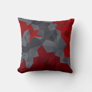 Grey, red randomly arranged triangles. cushion