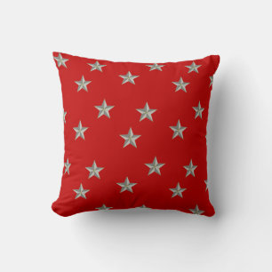 Grey stars on red cushion