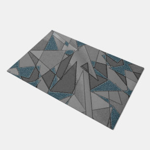 Grey triangle cutouts with rough dark blue pieces doormat