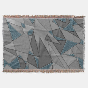 Grey triangle cutouts with rough dark blue pieces throw blanket
